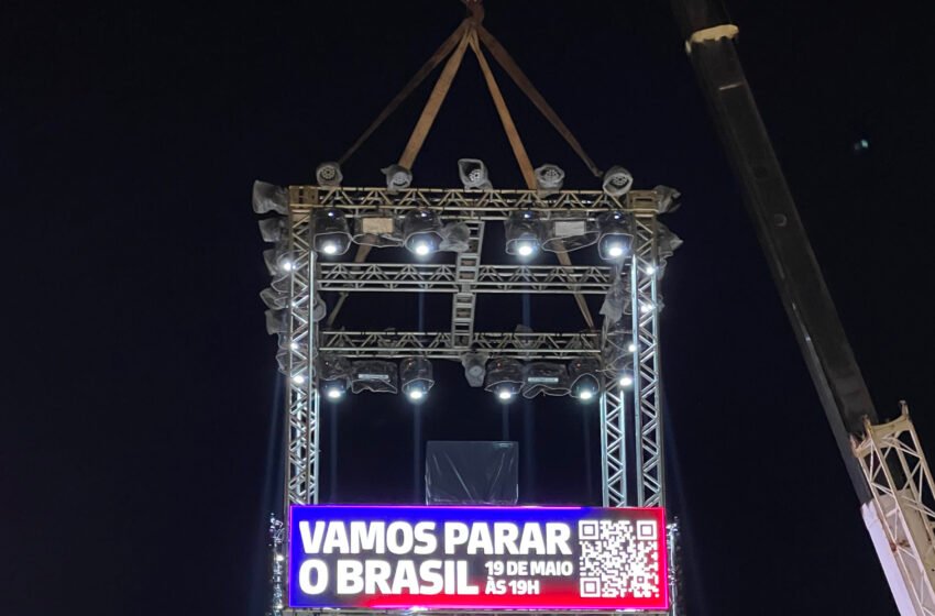 Rap In Cena promove ação com guindaste e ilusionismo para anunciar as primeiras atrações do festival
